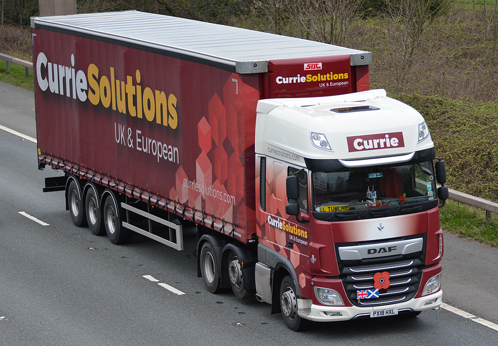 A Currie Solutions truck on the road.